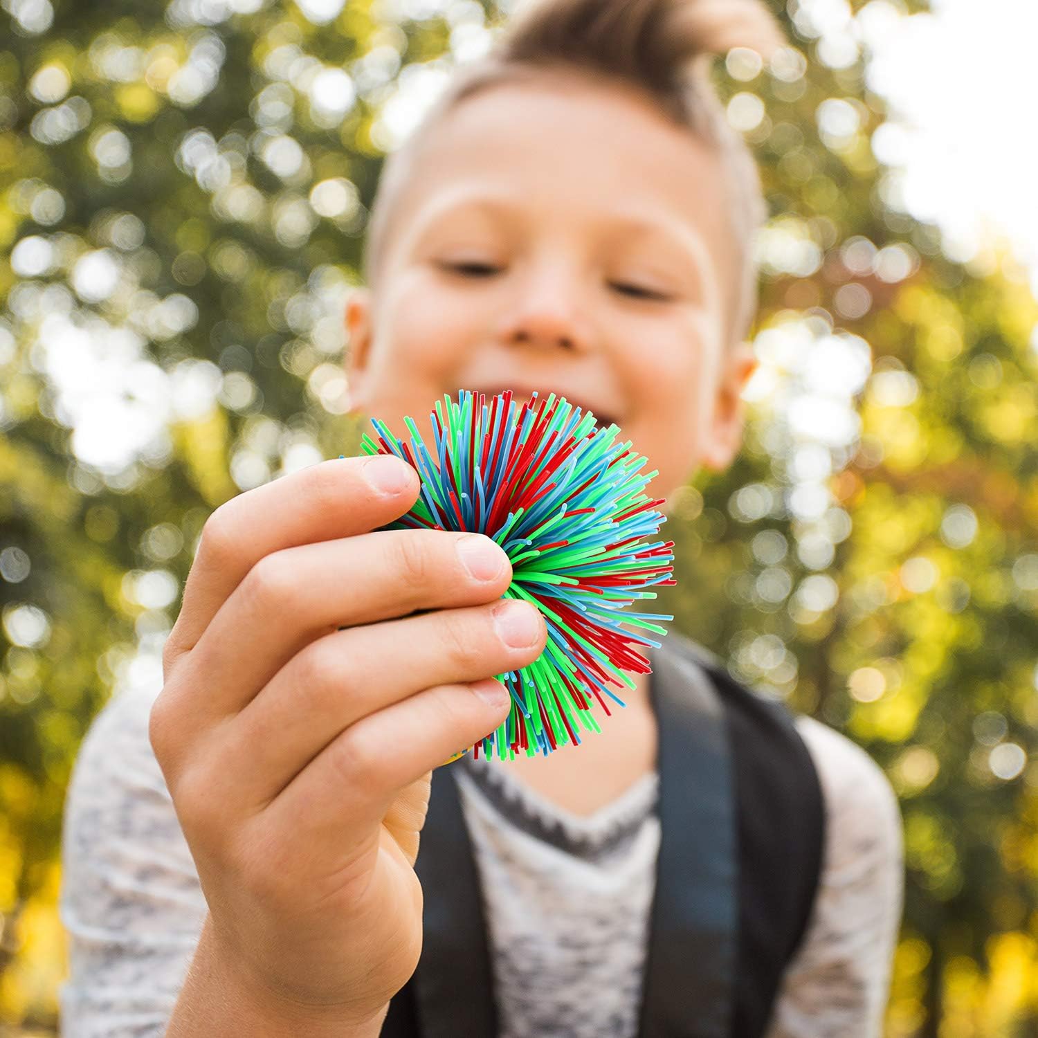 Leinuosen 12 Pieces Stringy Balls Sensory Stringy Ball End of Year Gifts Soft Rainbow Pom Bouncy Stress Bags Basket Stuffers Fillers Party Favors Birthday Gifts, Multicolor (2.75 Inch) - Image 6